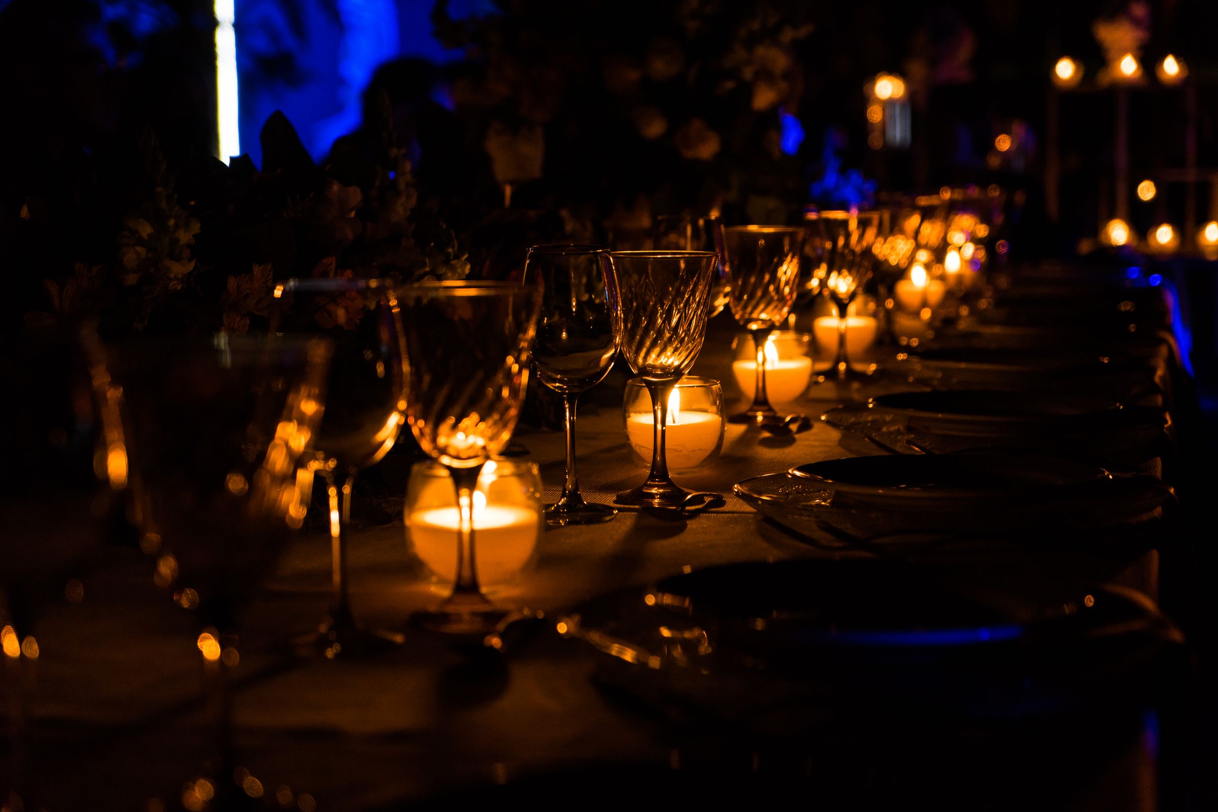 A candlelit dinner table set for an intimate evening